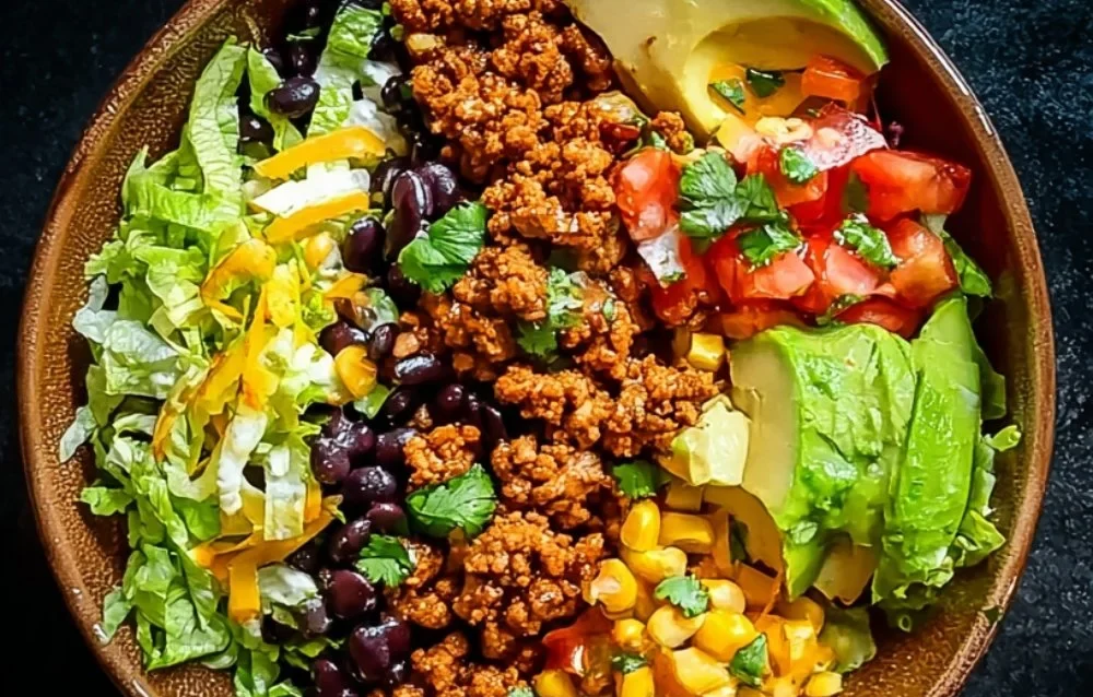 Colorful Taco Lunch Bowls with fresh ingredients and toppings for a healthy meal.