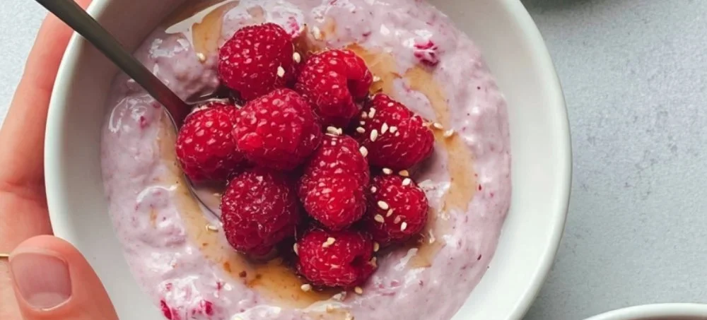 Delicious yogurt chia pudding topped with fresh fruit and nuts