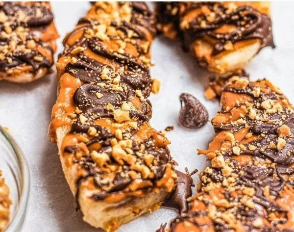 Frozen Banana Snickers dessert with sliced bananas and chocolate coating