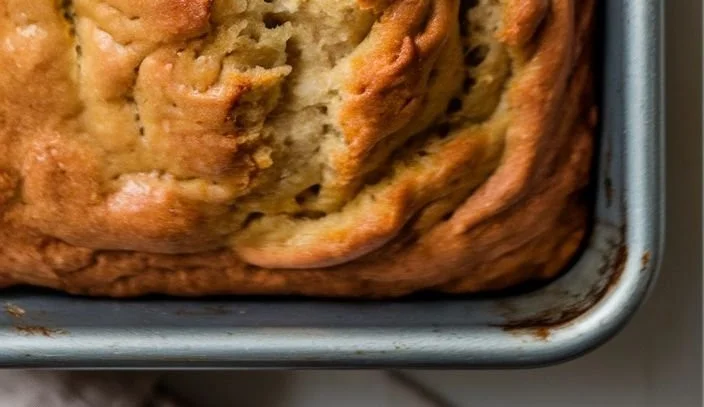 Delicious high protein banana bread slice on a plate, perfect for breakfast.